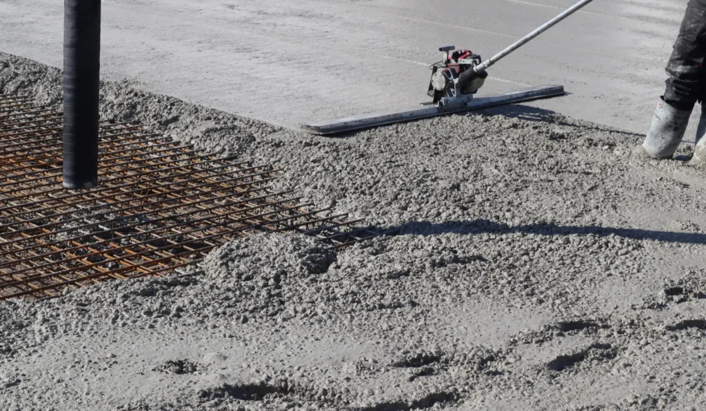 man smoothing the cement surface