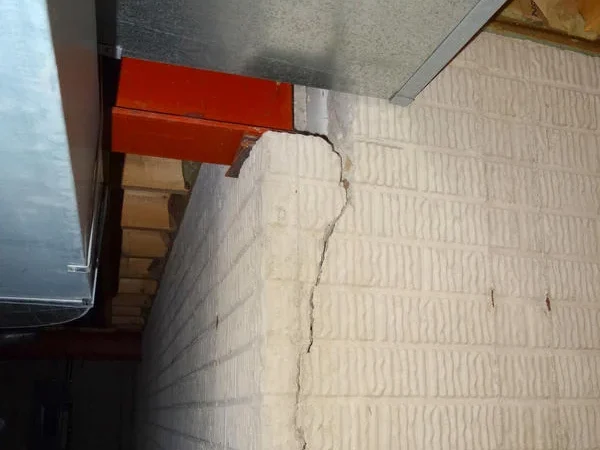 The hairline at a steel beam pocket